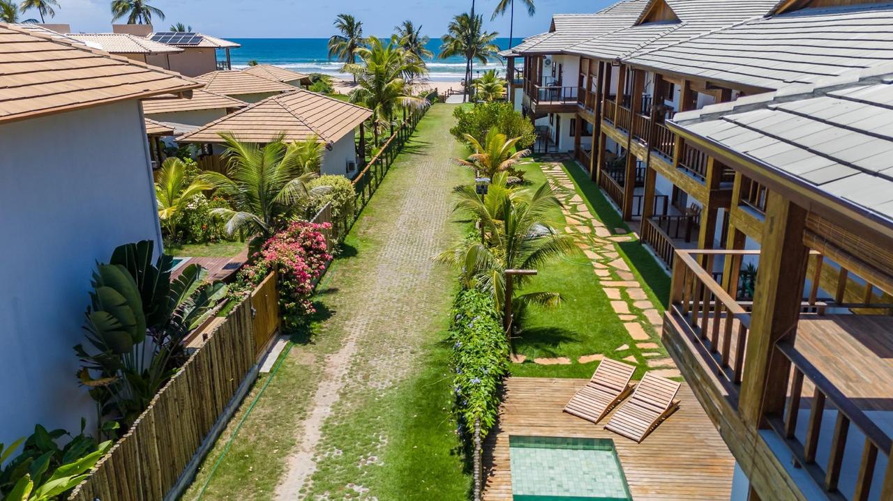 Two rows of apartments facing each other across the lawn at Caminho do Mar