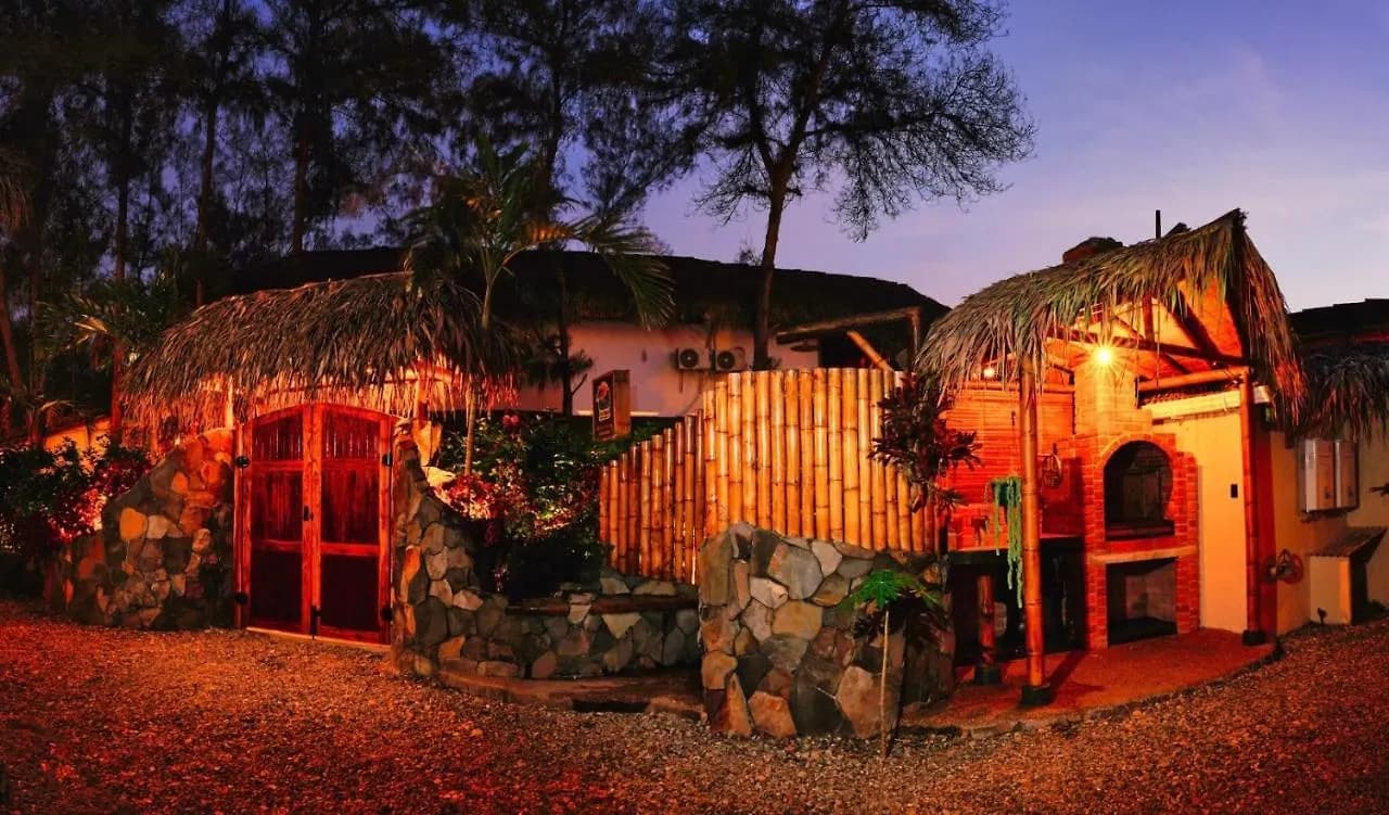 Tres Palmas entrance and brick grill lit up at night