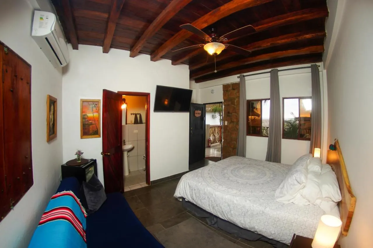 Room with ocean-view windows and a wood beam ceiling