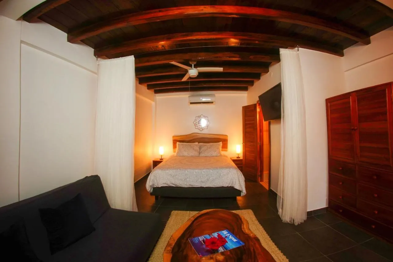 Suite with curtained bed and wardrobe